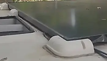 Rigid solar panel mounted on a camper van roof