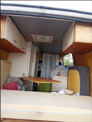 alt: Roof vent open in a camper van