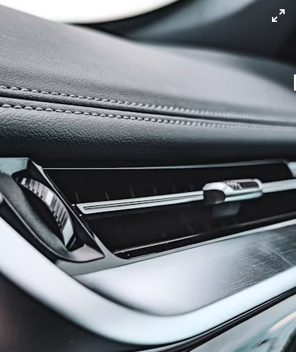 alt: Dashboard air vent in a camper van
