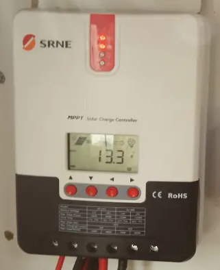 SRNE MPPT solar charge controller display showing 13.3V, a normal charging reading