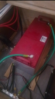 Battery cables running up toward the inverter, mounted above